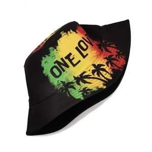 Detail of black bucket hat with "ONE LOVE" text and palm tree print in Rasta colors.