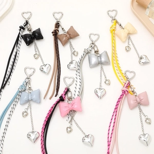 Leather bow and heart keychain charms in multiple colors with tassels for bags