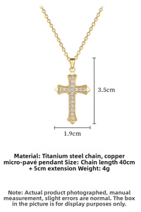 Detail view of gold cross pendant with micro-paved zircons and chain dimensions