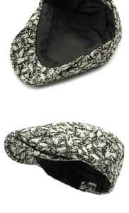 Detail of the black and white abstract pattern and inner lining of the beret flat cap