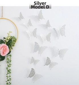 Detailed view of silver 3D hollow paper butterflies with laser-cut design for wall decor