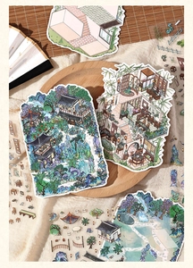 Detailed close-up of vintage Chinese style stickers on a wooden tray for scrapbooking