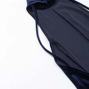 Detailed stitching and premium velvet texture of backless halter maxi dress in dark blue
