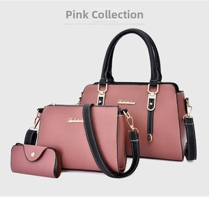 Detailed view of pink three-piece handbag set with pebble texture and gold hardware