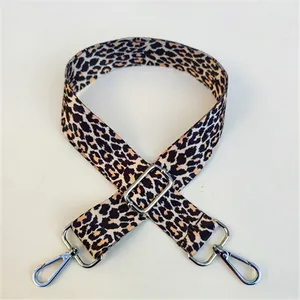 Detail view of leopard print wide strap for crossbody bag with adjustable silver hardware