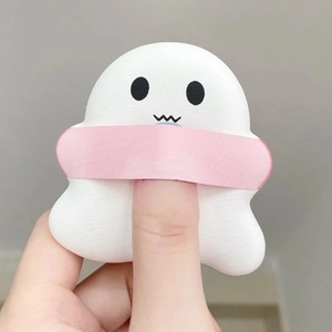 Close-up of white ghost-shaped marshmallow makeup sponge with a pink finger strap