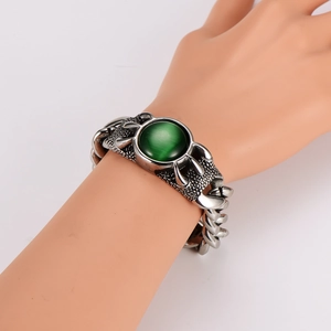 Detailed macro view of the vintage Cuban chain bracelet with green agate stone inlay