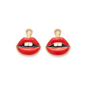 Macro shot of red enamel lips charms with gold metal edges for DIY jewelry making