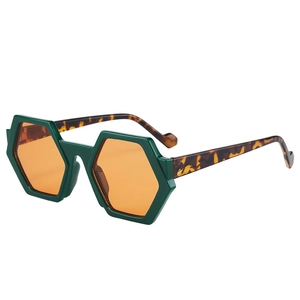 Green hexagonal sunglasses with orange lenses and tortoiseshell temples shown at 45-degree angle