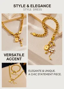Detail of gold Cuban chain set with clover zircon charm and tassel pendants