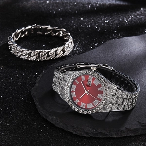 Detail of luxury iced-out watch with red dial and matching Cuban link diamond bracelet