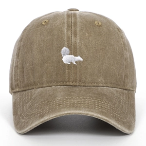 Detail of cute squirrel embroidery on washed cotton vintage baseball cap