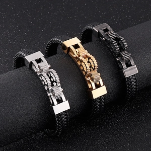 Detail of gear mechanical leather bracelets in silver, gold and black stainless steel