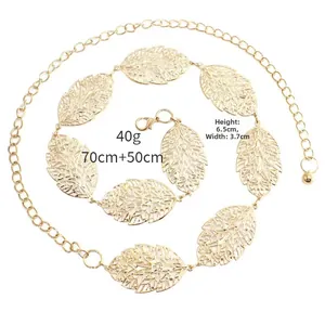 Detail of gold hollow leaf waist chain with adjustable metal link and lobster clasp