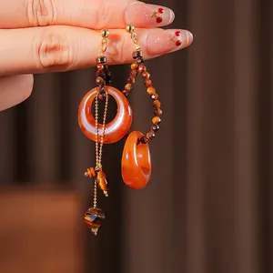 Vintage asymmetric earrings with tiger eye stone and resin ring on golden chain