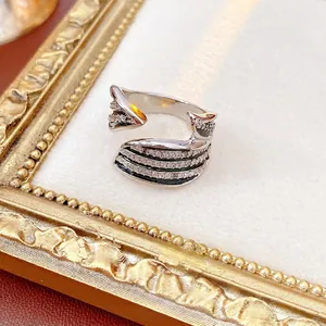 Vintage silver metal open ring with black enamel and zircon pavé in a retro gold frame