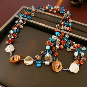 Bohemian multilayer necklace with turquoise beads and natural shell pieces on leather