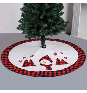 Detail view of snowman and pine tree embroidery on red and black buffalo check tree skirt