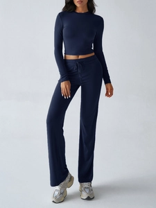Detail view of navy blue Y2K slim-fit long-sleeve crop top and drawstring pants set