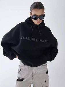 Black oversized drawstring hoodie with white logo print and front kangaroo pocket