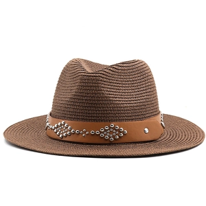 Vintage brown straw cowboy hat with silver studded leather band for men and women
