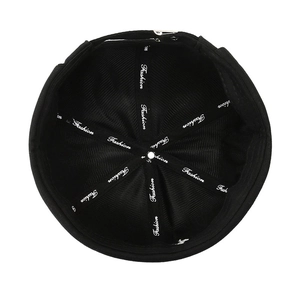 Inside view of black brimless sailor docker cap with reinforced fashion tape seams