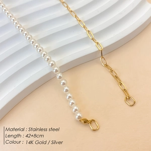 Faux pearl and golden stainless steel paperclip link necklace on a minimalist base
