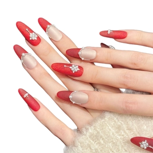 Red velvet stiletto press-on nails with pearl floral accents and golden bead charms