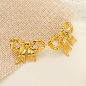 Minimalist 18k gold plated stainless steel bow earrings with a polished metallic finish