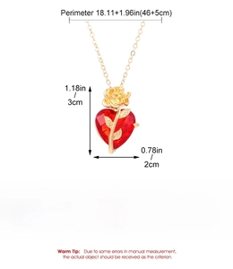 Detail of red heart pendant with golden rose engraving and measurement dimensions