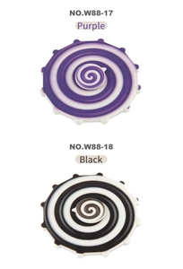 Detail view of rainbow fidget spinners in purple and black with gear-shaped edges