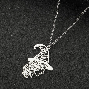 Detailed view of polished silver wizard pendant with hollow female silhouette profile