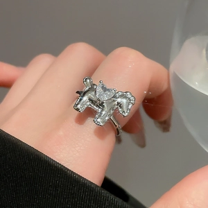 Detail of silver horse ring featuring a sparkling heart zircon and pave-set crystals