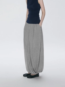Minimalist grey pleated irregular long skirt with Zen design and unique cocoon silhouette