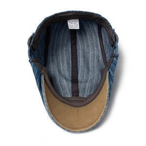 Interior view of denim beret hat with 100% cotton label and black sweatband