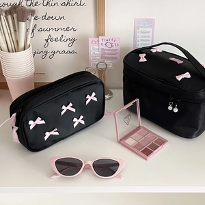 Elegant black satin makeup bag set with pink bows and pearl zipper charms for travel