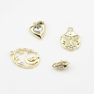 Golden alloy charms featuring heart, butterfly, moon and star designs with inlaid crystals