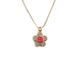 Gold necklace with flower pendant featuring pink smile face and zircon petals