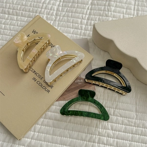 Set of four minimalist French curved hair claws in cream, white, black, and green colors
