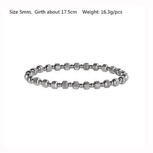 Detail of 5mm silver stainless steel beaded bracelet showing textured surface and dimensions