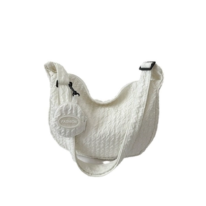 Minimalist white crossbody bag with bubble texture and round coin purse accessory
