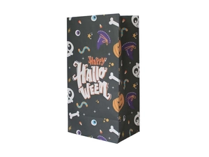 Detail of black Halloween paper gift bag with festive pumpkin and skull patterns