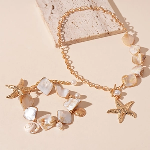 Ocean style necklace and bracelet set with shells, pearls and starfish charms