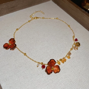 Vintage acrylic flower necklace with amber floral charms and colorful crystal beads