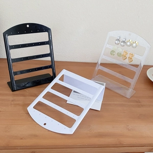 L-shaped acrylic earring display stands in black, white, and transparent finishes