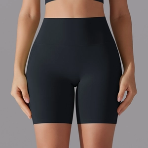 Detail of high-waist seamless black sports shorts with slimming compression effect