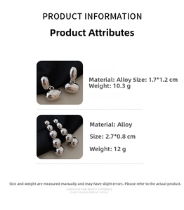 Detailed view of silver alloy geometric stud earrings featuring layered beads and linear drops