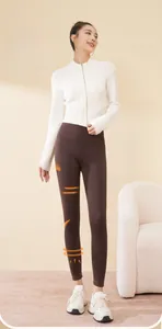 Deep brown high-waisted yoga pants with thermal fleece lining showing full body fit