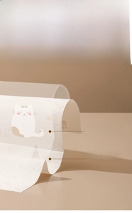 Detail of waterproof disposable placemat with PE film layer and cat print pattern
