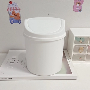 Cute white mini desktop trash can with press-top lid and minimalist round plastic design